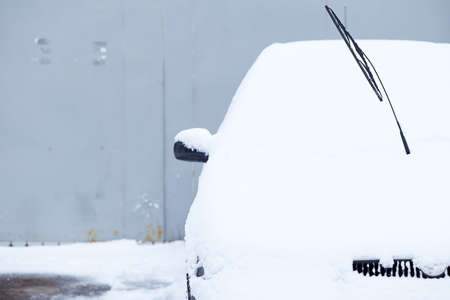 Window of car parked on the street in winter day, rear view. Mock-up for sticker or decals