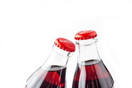 Kyiv, Ukraine- March 20, 2021: Coca-Cola Classic in a glass bottle Isolated on white Background. Close upのeditorial素材