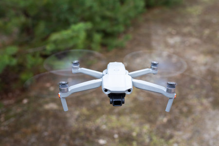 Flying drone in the forest. Flying for video and photo productions.