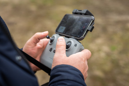 Hands in remote controller for drive a drone.の写真素材