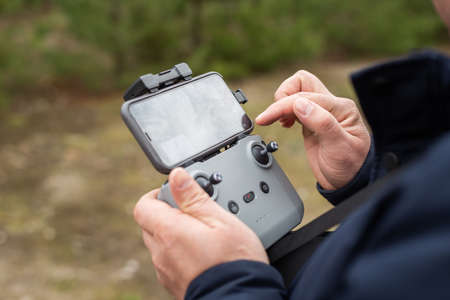 Hands in remote controller for drive a drone.の写真素材