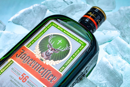 Ukraine, Poltava - July 11, 2022: Bottle of Jagermeister, German digestif made with 56 herbs and spices. bottle in iceのeditorial素材