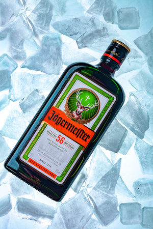 Ukraine, Poltava - July 11, 2022: Bottle of Jagermeister, German digestif made with 56 herbs and spices. bottle in iceのeditorial素材