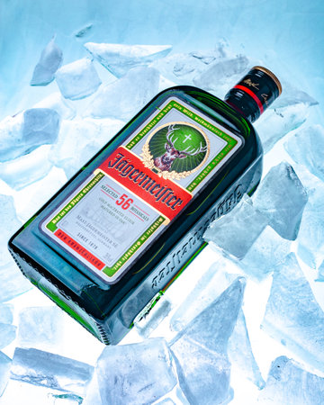 Ukraine, Poltava - July 11, 2022: Bottle of Jagermeister, German digestif made with 56 herbs and spices. bottle in iceのeditorial素材