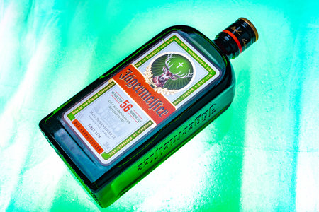 Ukraine, Poltava - July 11, 2022: Bottle of Jagermeister, German digestif made with 56 herbs and spices. bottle in iceのeditorial素材