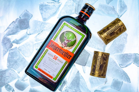 Ukraine, Poltava - July 11, 2022: Bottle of Jagermeister, German digestif made with 56 herbs and spices. bottle in iceのeditorial素材
