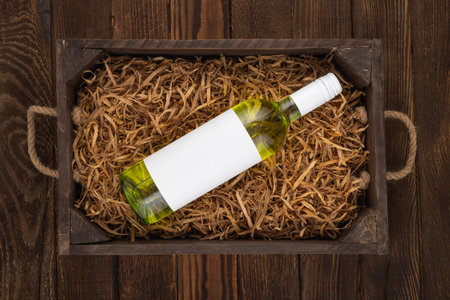 Wine Box: wine bottle with white label on wooden background. Mock upの写真素材