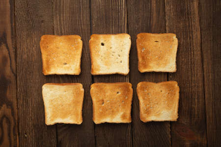 Set of six slices toast bread on wooden backgroundの写真素材