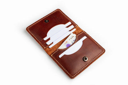 Brown leather wallet with blank cards, isolated on white backgroundの写真素材