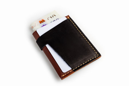 Black leather wallet with blank cards, isolated on white backgroundの写真素材