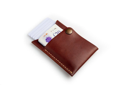 Brown leather wallet with blank cards and money, isolated on white backgroundの写真素材