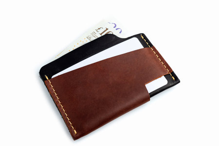 Brown leather wallet with blank cards, isolated on white backgroundの写真素材