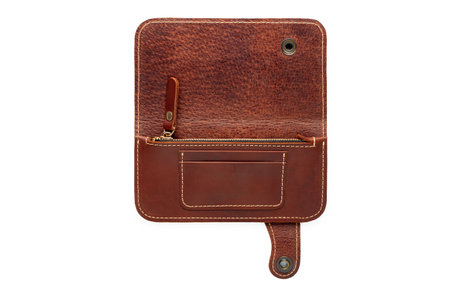 Big brown leather wallet on a button on a white background, opened top viewの写真素材