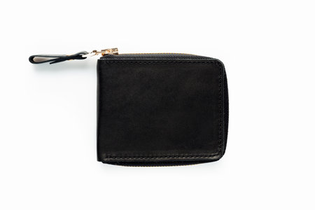 Black leather wallet with zipper isolated on white backgroundの写真素材