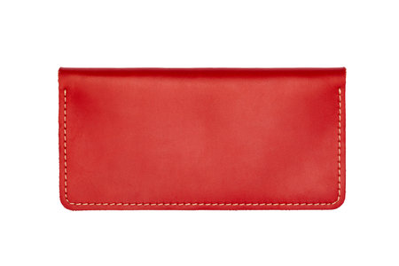 Big red leather wallet on a button on a white background. top viewの写真素材