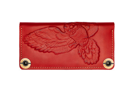 Big red leather wallet on a button on a white background, owl print. top viewの写真素材