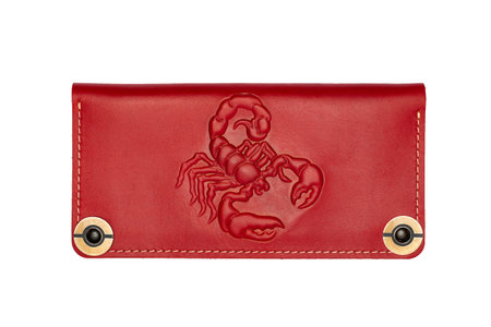 Big red leather wallet on a button on a white background, scorpion print. top viewの写真素材