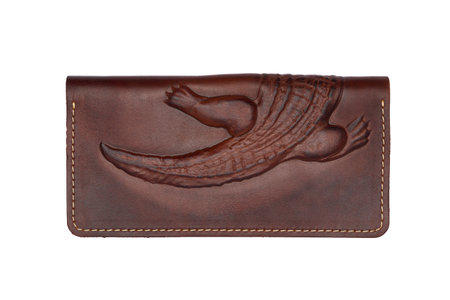 Big brown leather wallet on a button on a white background, crocodile print. top viewの写真素材
