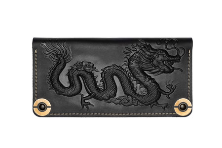 Big black leather wallet on a button on a white background, dragon print. top viewの写真素材