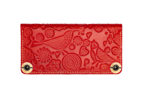 Big red leather wallet on a button on a white background, birds print. top viewの写真素材