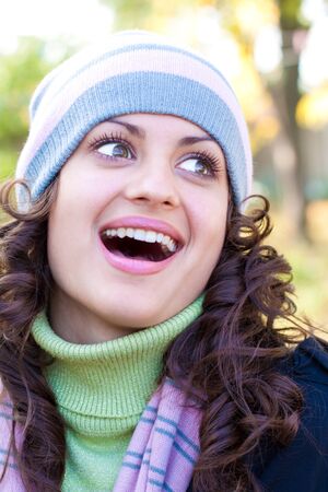 Portrait of a beautiful young woman smiling outdoorsの写真素材