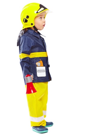 Little boy in fireman costume with megaphone isolated on whiteの写真素材