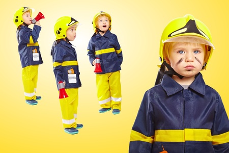 Group of little boys in fireman costumeの写真素材