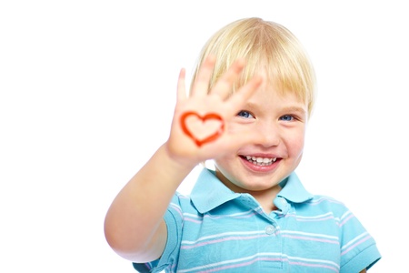 Happy kid with painted heart shape on his handの写真素材