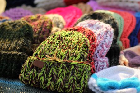 Heap of colorful trendy knitted hatsの写真素材