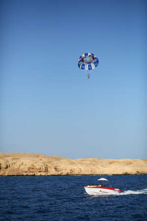 Sharm el Sheikh, Egypt - March 15, 2020: People on a boat are getting ready for parasailing in the Red Seaのeditorial素材