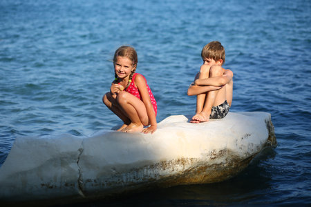 <p>Children sunbathing on the rock on the cyprus seashore</p>の写真素材