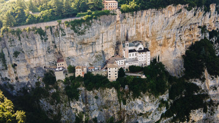 Drone landscape view of historic sanctuary on Italian mountain cliffの写真素材
