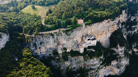 Drone view of sanctuary church architecture built on Italian cliffsideの写真素材