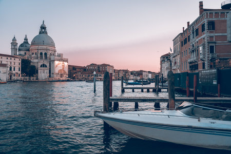 Canal waterfront at dusk with pastel skyの写真素材