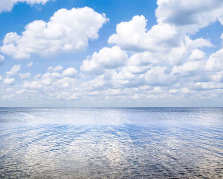 Sea landscape with blue sky and white clouds.