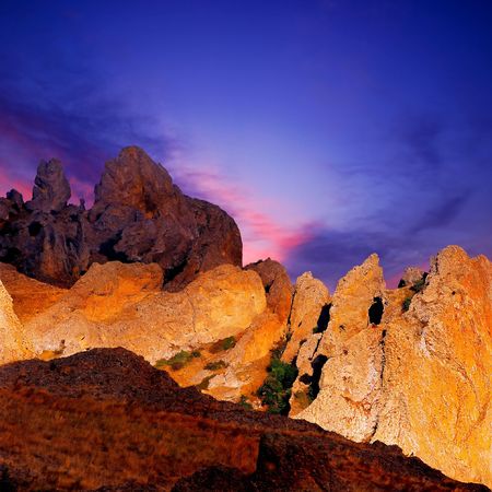 Orange rocks on blue sky background.の写真素材