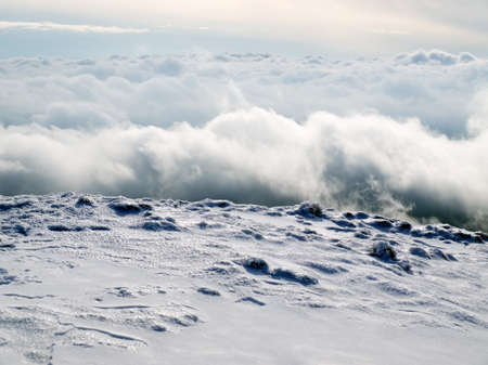 Snow and cumulus clouds.の写真素材