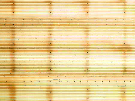 Yellow corrugated fence.