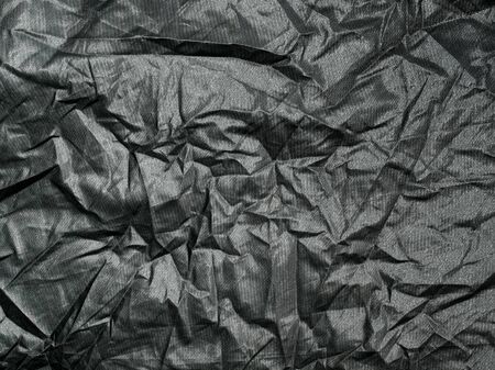 Crumpled cloth texture closeup background.の写真素材