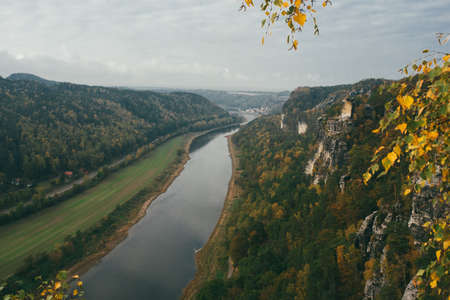 Big river between mountains autumn panorama view from aboveの写真素材
