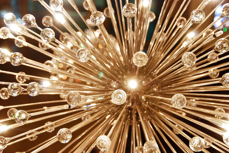 A grand glass shiny ceiling chandelier in the shape of dandelionの写真素材