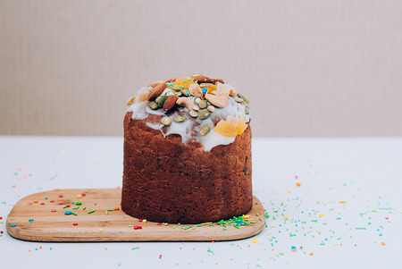 Selective focus close up image of freshly baked delicious Easter cake freshly baked, multicolored...