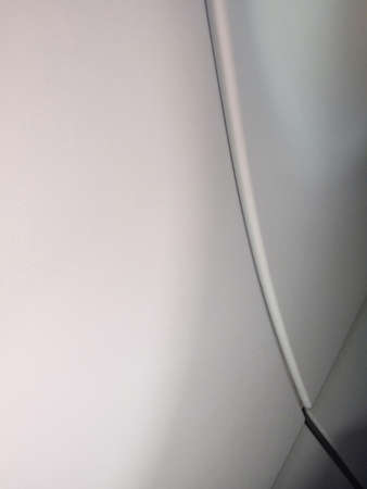 white car detail, smooth background. Abstract white metal surface of a car doorの写真素材