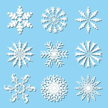 Set of nine white snowflakes on blue background.のイラスト素材