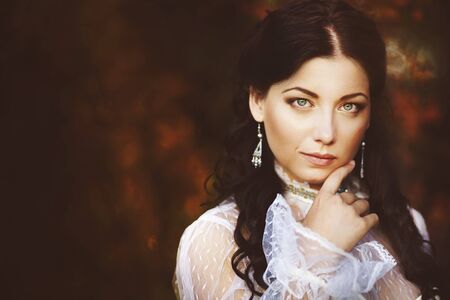 Gorgeous brunette beauty in a old-fashioned dress の写真素材