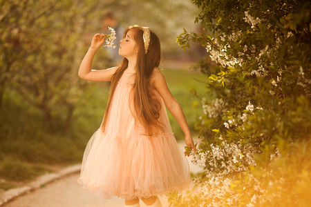 cute little girl in the park in springの写真素材