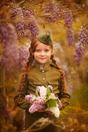 cute little girl in a military uniformの写真素材