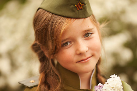 cute little girl in a military uniformの写真素材