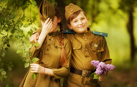 Boy with a girl in military uniform.day of victoryの写真素材