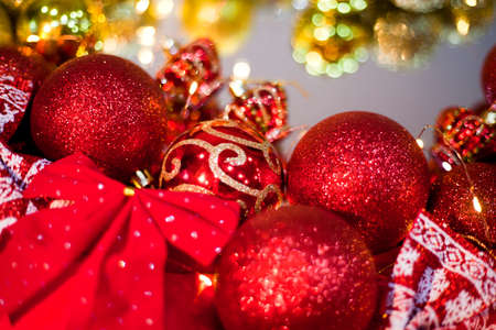 Christmas balls lie on the mirror.red and goldの写真素材